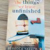 Things We Leave Unfinished by Rebecca Yarros is a poignant and deeply moving contemporary romance novel that explores love, loss, and the bittersweet nature of unfinished stories. Yarros, known for her emotionally charged storytelling, delivers a narrative that resonates with readers seeking a heartfelt exploration of relationships, personal growth, and the consequences of choices left unresolved. The novel centers on Brooke, a young woman navigating the aftermath of a relationship that ended abruptly, leaving lingering questions and unresolved feelings. The story alternates between the past and present, gradually revealing the events that shaped Brooke’s emotional journey and the decisions that have left her longing for closure. Through this structure, Yarros masterfully illustrates how past experiences shape who we are and how the things we leave unfinished can influence our present and future. At the heart of Things We Leave Unfinished is the theme of second chances. Brooke finds herself confronting her past, revisiting decisions, and encountering people she thought she had left behind. The story highlights the importance of communication, forgiveness, and vulnerability in relationships, showing that love often requires courage and the willingness to face difficult truths. Readers witness Brooke’s growth as she learns to navigate complex emotions and reconcile her past with her desires for the future. Romance is woven seamlessly into the narrative, with Yarros creating characters who feel real, relatable, and deeply human. The romantic arc is tender, filled with emotional highs and lows that capture the intensity of first love, heartbreak, and the longing for connection. The chemistry between Brooke and her love interest is palpable, blending passion with emotional depth, making their journey both captivating and relatable. Another compelling aspect of the novel is the exploration of loss and grief. Brooke’s experiences reflect the universal struggle of coping with what we cannot change and learning to accept imperfection in ourselves and others. Yarros portrays these emotions with sensitivity and authenticity, allowing readers to empathize deeply with the characters’ experiences. Things We Leave Unfinished