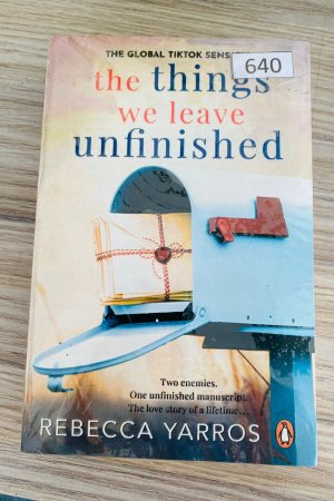 Things We Leave Unfinished by Rebecca Yarros is a poignant and deeply moving contemporary romance novel that explores love, loss, and the bittersweet nature of unfinished stories. Yarros, known for her emotionally charged storytelling, delivers a narrative that resonates with readers seeking a heartfelt exploration of relationships, personal growth, and the consequences of choices left unresolved. The novel centers on Brooke, a young woman navigating the aftermath of a relationship that ended abruptly, leaving lingering questions and unresolved feelings. The story alternates between the past and present, gradually revealing the events that shaped Brooke’s emotional journey and the decisions that have left her longing for closure. Through this structure, Yarros masterfully illustrates how past experiences shape who we are and how the things we leave unfinished can influence our present and future. At the heart of Things We Leave Unfinished is the theme of second chances. Brooke finds herself confronting her past, revisiting decisions, and encountering people she thought she had left behind. The story highlights the importance of communication, forgiveness, and vulnerability in relationships, showing that love often requires courage and the willingness to face difficult truths. Readers witness Brooke’s growth as she learns to navigate complex emotions and reconcile her past with her desires for the future. Romance is woven seamlessly into the narrative, with Yarros creating characters who feel real, relatable, and deeply human. The romantic arc is tender, filled with emotional highs and lows that capture the intensity of first love, heartbreak, and the longing for connection. The chemistry between Brooke and her love interest is palpable, blending passion with emotional depth, making their journey both captivating and relatable. Another compelling aspect of the novel is the exploration of loss and grief. Brooke’s experiences reflect the universal struggle of coping with what we cannot change and learning to accept imperfection in ourselves and others. Yarros portrays these emotions with sensitivity and authenticity, allowing readers to empathize deeply with the characters’ experiences. Things We Leave Unfinished